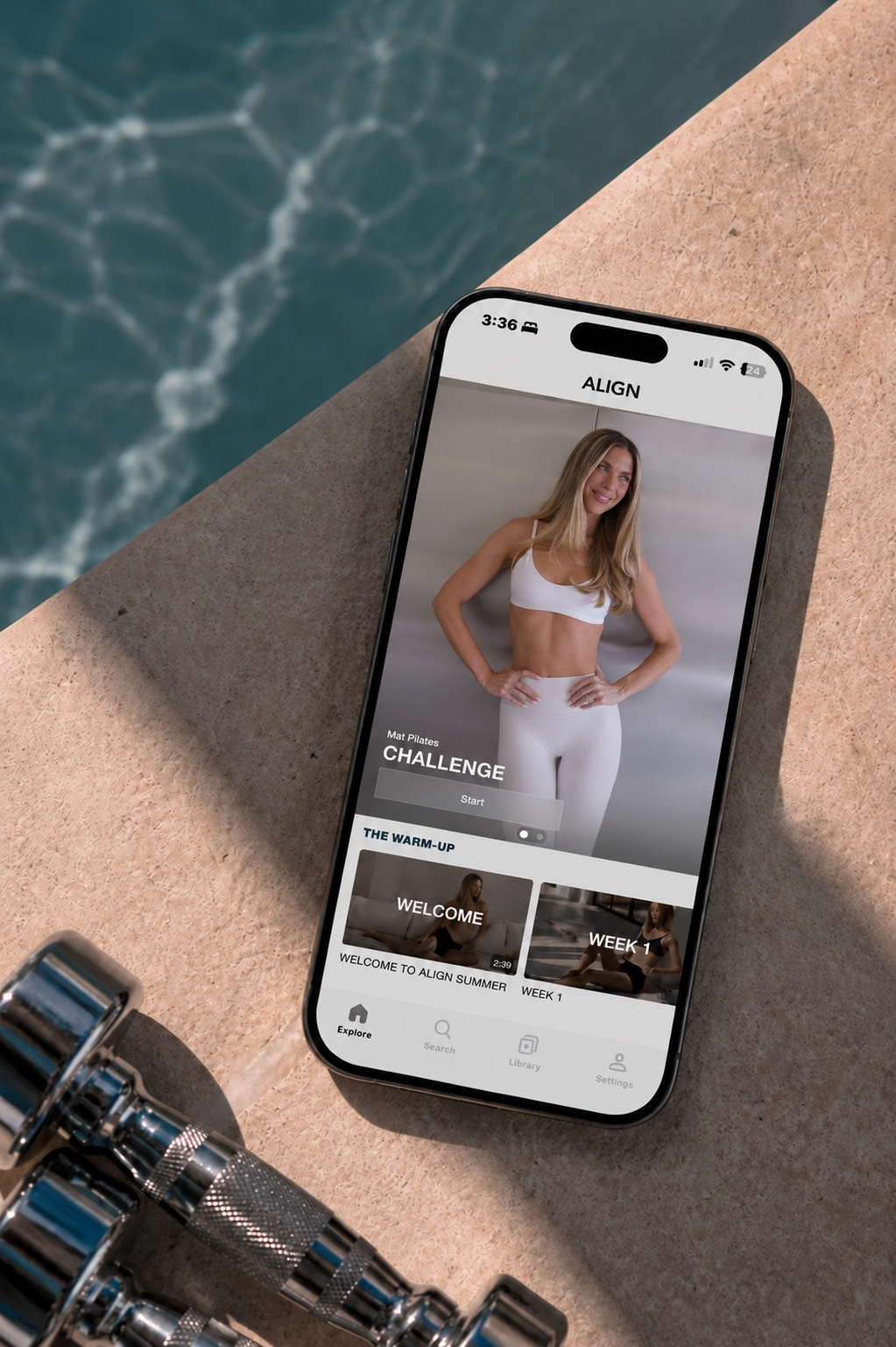 The Align app showing Pilates classes and guided programs on an iPhone beside a pool